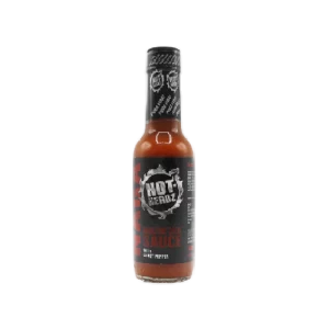 Botella de salsa picante Hot-Headz Naga Deadly Hot Chilli Sauce 148ml, con un pimiento fantasma (ghost pepper) en la etiqueta.