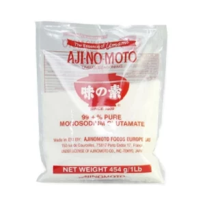 Imagen de un paquete de Glutamato Monosódico Ajinomoto de 454 gramos. El paquete es de color blanco y tiene el logotipo de Ajinomoto en la parte superior. El texto del paquete dice "Glutamato Monosódico Ajinomoto" y "454 gramos"