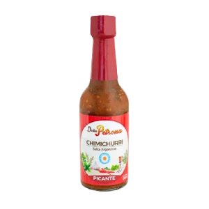 El chimichurri picante Doña Petrona 190ml es una salsa picante de uso culinario que se usa para condimentar carnes, aves y pescados. Está hecho con una base de aceite de girasol, vinagre de vino tinto, perejil, orégano, ajo, pimienta negra y chiles picantes.